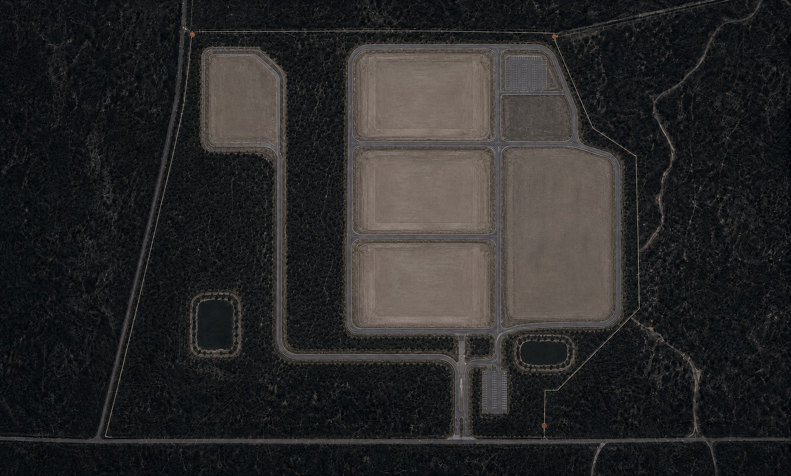 The same frame after horizontal development: six pale graded pads cut into the woods on a service loop, two impoundments dug west and south, the ochre boundary unchanged.